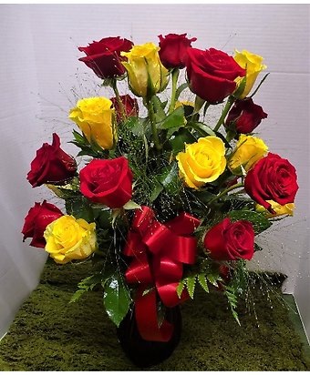 Two Dozen Red & Yellow Roses in a Red Vase Roses